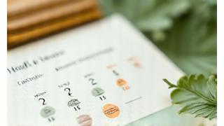Calendar with marked dates and a subtle leaf motif, symbolizing a consistent 21-day challenge.